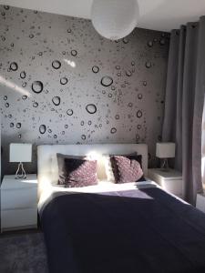 Posteľ alebo postele v izbe v ubytovaní Apartament Winnica