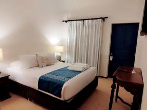 Cama ou camas em um quarto em Katari at Plaza de Armas Cusco