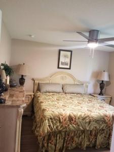 a bedroom with a large bed and two lamps at Home Sweet Home in Fort Myers