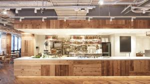 a kitchen with wooden cabinets and a counter top at Hotel Metropolitan Kamakura in Kamakura