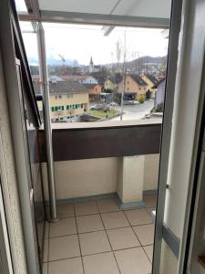 a room with a view of a city from a window at Sunny private Apartment in an amazing valley in Wila