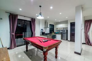 a kitchen with a pool table in a room at Chic Chill Party Hua-Hin Private Poolvilla from beach 3km in Hua Hin