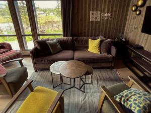 Χώρος καθιστικού στο Unique cabin with fantastic lake view, sauna, ski & EV outlet +39 φωτογραφίες