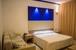 Postel nebo postele na pokoji v ubytování Park Hotel Tyrrenian