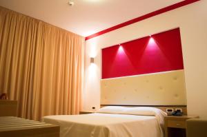Postel nebo postele na pokoji v ubytování Park Hotel Tyrrenian