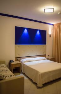 Postel nebo postele na pokoji v ubytování Park Hotel Tyrrenian