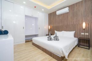 Ένα ή περισσότερα κρεβάτια σε δωμάτιο στο 2-Bedroom Apartment at Calypso Garden Residences