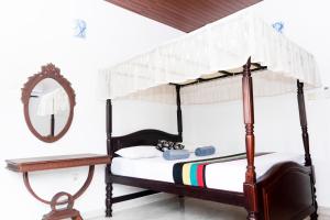 Postel nebo postele na pokoji v ubytování Kandy Riverside Villa