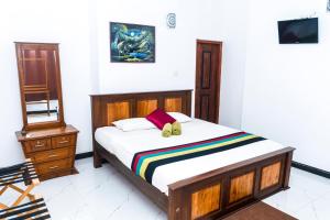 Postel nebo postele na pokoji v ubytování Kandy Riverside Villa
