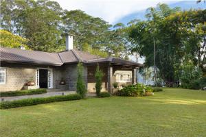 a house with a grass yard at The Lavender House by Reveal in Kandy
