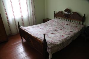 Een bed of bedden in een kamer bij Guest House LALI