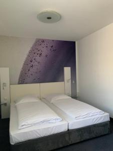 Postel nebo postele na pokoji v ubytování Eisberg Hotel Schwanen