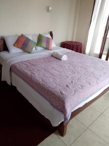 Postel nebo postele na pokoji v ubytování Tunjung Guest House
