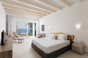 Postel nebo postele na pokoji v ubytování Nisos Villas Corfu