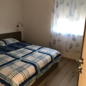 Postel nebo postele na pokoji v ubytování Holiday apartment in Punat with terrace, air conditioning, WiFi, washing machine 4534-3