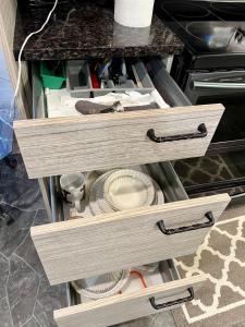 two drawers in a counter with a plate in it at Resort style home living in Delta