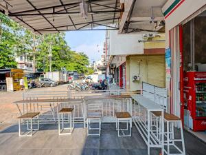 a group of tables and chairs on a street at OYO 91784 Zazezo Homestay Syariah in Tanjung Pinang