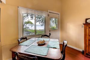 a dining room with a table and a window at Charming St Albans Cottage on Lake Champlain! in Melville Landing