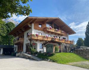 a house with balconies on the side of it at Haus Bernhard in Ramsau am Dachstein