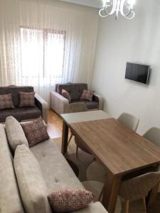 a living room with a couch and a table at Sumgait Boulevard in Sumqayıt