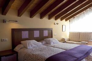 เตียงในห้องที่ Hotel Rural Reciegos Complejo Agroturistico