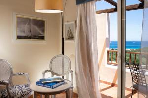 a room with a view of the ocean at CPH | Pevero Hotel in Porto Cervo