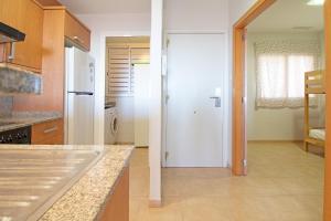 Kuchyňa alebo kuchynka v ubytovaní Global Properties, Apartamento con gran terraza y piscina