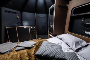 a room with a bed and a tv in it at Aurora hut igloo in Rovaniemi