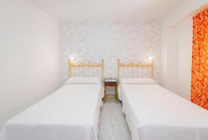 Postel nebo postele na pokoji v ubytování Hotel Manzanito