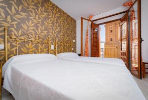 Postel nebo postele na pokoji v ubytování Hotel Manzanito