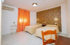 Postel nebo postele na pokoji v ubytování Hotel Manzanito