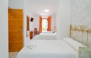 Postel nebo postele na pokoji v ubytování Hotel Manzanito