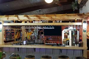 a bar with stools in a room at Casa Lemus Inn in Raton