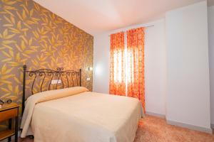 Postel nebo postele na pokoji v ubytování Hotel Manzanito