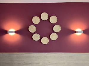 a group of wooden plates on a wall with lights at Alda Santa Trega in A Guarda