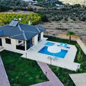 an overhead view of a house with a swimming pool at Villa Adrasan in Kumluca