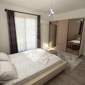 a bedroom with a large bed and a large mirror at Villa Adrasan in Kumluca