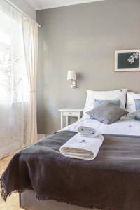 Posteľ alebo postele v izbe v ubytovaní Hornigold Apartament Gdynia