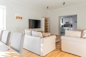 Televízia a/alebo spoločenská miestnosť v ubytovaní Hornigold Apartament Gdynia