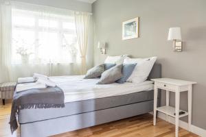 Posteľ alebo postele v izbe v ubytovaní Hornigold Apartament Gdynia