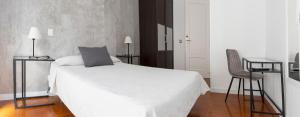 Postel nebo postele na pokoji v ubytování Hostal Tokio