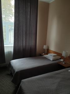 Postel nebo postele na pokoji v ubytování Hotel Yes