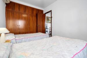 A bed or beds in a room at Villa Rosita