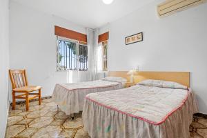 A bed or beds in a room at Villa Rosita