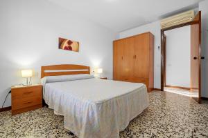 A bed or beds in a room at Villa Rosita