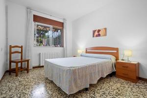 A bed or beds in a room at Villa Rosita
