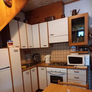 Kuchyň nebo kuchyňský kout v ubytování Cà dul straciatin