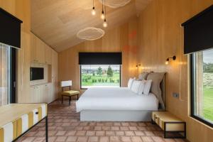 Säng eller sängar i ett rum på ARCA Resort