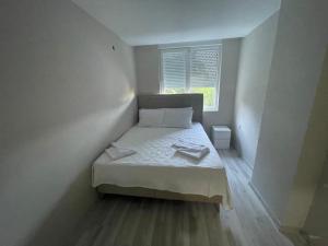 Postel nebo postele na pokoji v ubytování Hurma Flats