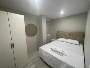Postel nebo postele na pokoji v ubytování Hurma Flats